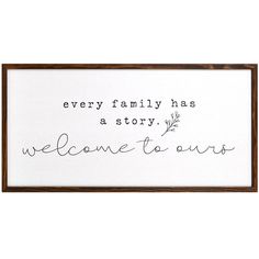 a framed sign that says, every family has a story welcome to ours