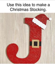 the letter j is made up of glittery paper and has a santa hat on it