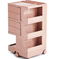 a pink cart with three drawers and wheels on the front, sitting against a white background