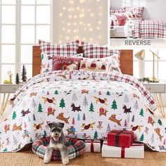 a dog sitting on the floor next to a christmas themed bed