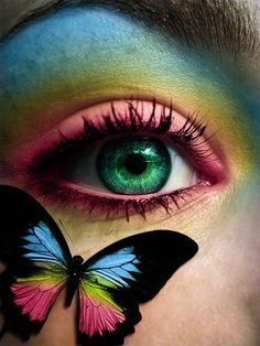 a woman's eye with the words bobbie painted on it and a butterfly