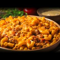 a bowl filled with macaroni and cheese on top of a table