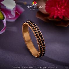 Let your wrists tell a story of tradition with our gold Bangle .  We are open from 10 am to 8 pm  𝐋 𝐨 𝐜 𝐚 𝐭 𝐢 𝐨 𝐧 : M.G. ROAD, JAYANAGAR, RAJAJINAGAR, C T STREET  For Enquiry: +91 9108701007  #navrathan #navrathanjewellers #thisisnavrathan #jewelry #jewellerydesign #JewelleryAddicts #jewellerylovers #expressyourself #jewelryaddict #antiquejewellery #antiqebeauty #timelesstreasures #luxuryjewellery  #bridaljewellery #antiquejewellery #southindianbride #northindianbride #signaturejewellery #tradit Indian Bangles Gold Design, Black Bangles, Tandoori Recipes, Black Ornaments, Heavy Jewellery, Mughal Jewelry, Black Bangle