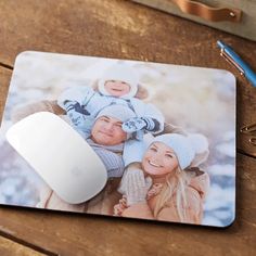 a mouse pad with an image of a family on it