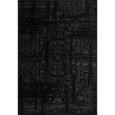 a black rug with an intricate design on the front and back side, in dark colors