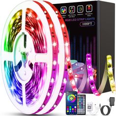 the colorful led strip lights are on display with remotes and cables next to it