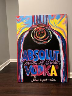 a painting with the words absolut vodka on it in front of a white wall