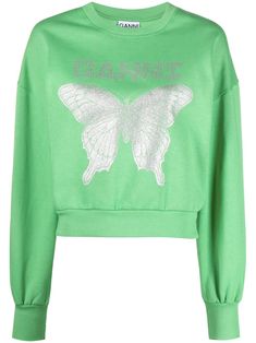 a green sweatshirt with a white butterfly on the chest and words written in silver foil