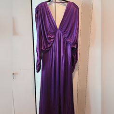 The Satin Batwing Midi Dress In Purple By Asos Edition. Tag Says Us 10. Fits Size 14. Waist Is 16.5 In. No Ptp Due To Bathing Design. Cuffs Zipper. Has Shoulder Pads And Is Lined. Very Dramatic Dress. Please Go To Asos To See. Never Worn. Is Presently $70 On Asos Site. Purple V-neck Lined Dress, Purple V-neck Maxi Dress For Cocktail, Lined Purple Evening Dress, Purple Lined Evening Dress, Purple Lined Dress For Evening, Lined Purple Dress For Evening, Purple V-neck Dinner Dress, V-neck Cocktail Maxi Dress, Dramatic Dress