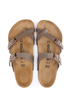 Style and comfort come naturally with these Birkenstock Mayari Sandals in Mocha. Double strap construction with adjustable metal buckles and leather insoles are a few qualities that make this fashion-forward Birkenstock Sandal perfect for everyday wear. Features of Birkenstock Mayari Sandals for Women in Mocha 71061: Birkenstock Style: 71061 Color: Mocha Leather insole Suede footbed Birko-Flor® upper Textured Cork outsole Two straps with adjustable metal buckles Toe loop Birkenstock branded logo Mocha Birkenstock, Birkenstock With Socks, Super Birki, Chef Shoes, Clog Boots, Saltwater Sandals, Birkenstock Women, Birkenstock Sandals, Birkenstock Mayari