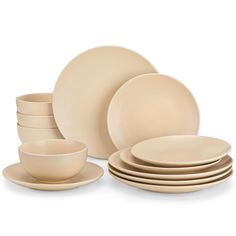 a set of beige dinnerware on a white background