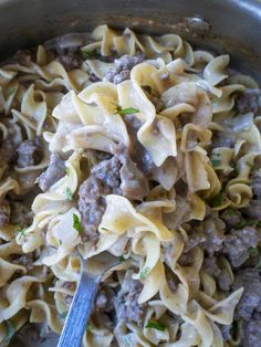 a pan filled with pasta and meat sauce