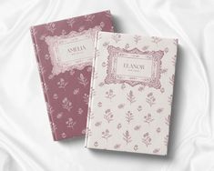 two personalized notebooks sitting on top of a bed