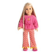 an american girl doll with blonde hair and pink outfit, standing on a white background