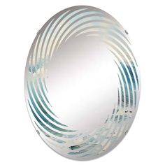 a round mirror with blue and white designs on it's sides, against a white background