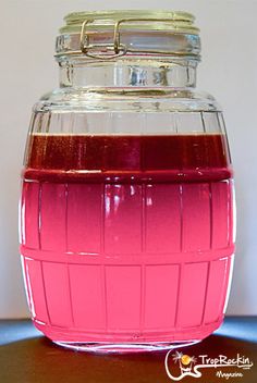 a jar filled with liquid sitting on top of a table