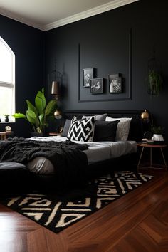 a bedroom with black walls and wooden floors