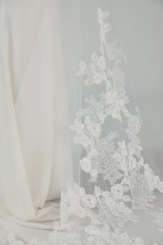 a veil with white flowers on it