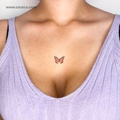 a woman's breast with a butterfly tattoo on her left side and right breast