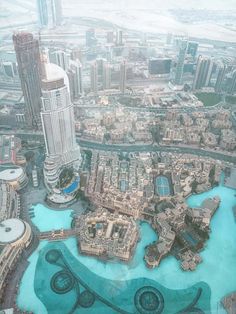 an aerial view of the city and its surrounding water features in this photo taken from above