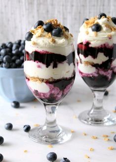 two glasses filled with blueberry cheesecake ice cream