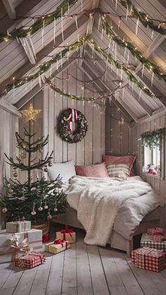 a bedroom decorated for christmas with presents under the tree and lights hanging from the ceiling