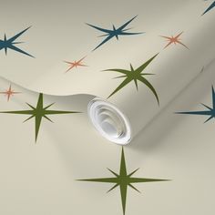 a wallpaper with stars on it and a white paper roll in the foreground