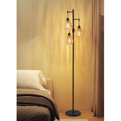 a floor lamp with three lights on it