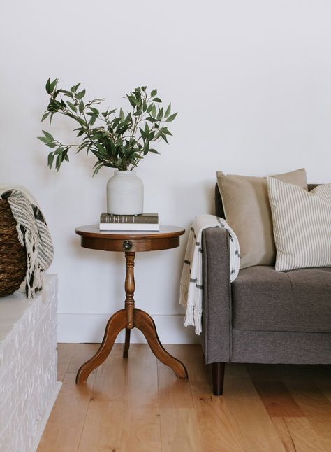 The little round end table trend - My vintage pedestal end table and 15 other little round end tables. Modern Traditional round pedestal tables, hourglass side tables, and 3 legged end tables. | Nadine Stay #endtable #sidetable #roundtable #vintagesidetable #vintagefurniture #moderntraditionaldecor #livingroomdecor #livingroominspo #pedestaltable #hourglasstable #flutedtable Vintage Modern Side Table, Round Vintage End Table, Round End Table Wood, Side Table Decor Living Room Vintage, Livingroom End Table, Antique Wood Side Table, Small Living Room Side Table, Round Side Table Styling Living Room, Vintage Pedestal Table