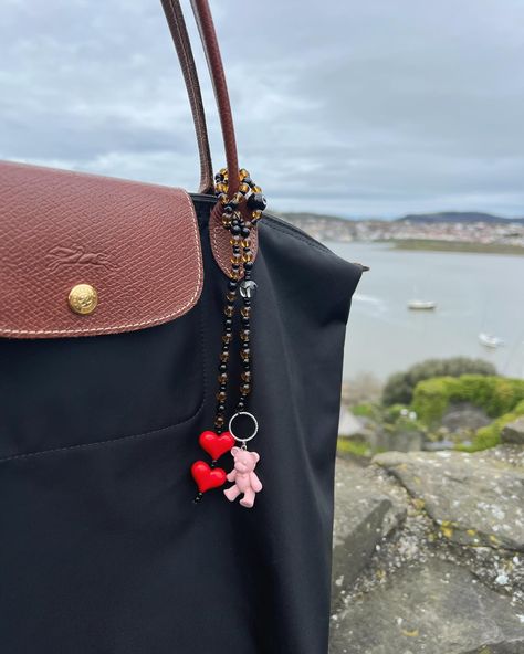 Add a touch of whimsy to your style with our adorable beaded bag charm! ❤️🐻 Diy Bag Charm Ideas, Aesthetic Bag Charms, Bag Charm Trend, Beaded Bag Charm, Bag Charms, Leather Bag Charm, Beads Bag Charm, Bead Backpack Charm, Diy Bag Charm