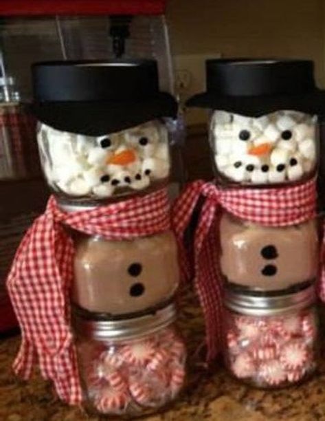 three 6 oz. jars stacked to make one snowman (marshmallows, hot chocolate mix & peppermint candies) makes approx. 6-8 cups of hot chocolate. Hat available with or without flower.... Please specify when ordering. Cute Gift or place setting idea... Hot Chocolate Snowman Kit/Gift. Snowmans scarf color Snowman Jars, National Hot Chocolate Day, Diy Snowmen, Snowman Hot Chocolate, Hot Chocolate In A Jar, Christmas Wrapper, Christmas Candy Jars, Invincible Summer, Hot Cocoa Gift