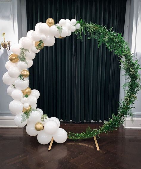 Circle Arch rental plus balloon and greenery styling -- perfect for a wedding ceremony, behind a sweetheart table, or backdrop for a photoshoot or event. Balloon Arch Backdrop Wedding, Greenery Balloon Arch, Balloon Circle Backdrop, Circle Backdrop With Drapes, Half Circle Balloon Arch, Gold Ring Backdrop With Balloons, Round Arch Backdrop Christmas, Gold Hoop Balloon Backdrop, Cover Garage Walls