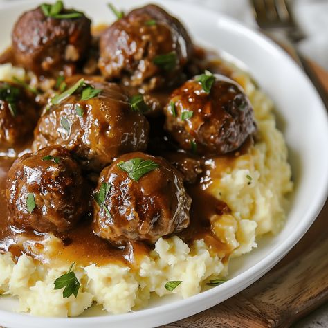 Savor the comfort of "Comfort Classic: Slow Cooker Salisbury Steak Meatballs," a hearty and delicious dish that transforms the traditional Salisbury steak into succulent, easy-to-serve meatballs. Cooked slowly in a rich mushroom gravy, these meatballs Salisbury Steak Crockpot, Meatball Recipes Crockpot, Salisbury Steak Meatballs, Slow Cooker Salisbury Steak, Rasta Pasta, Meatballs And Gravy, Baked Ribs, Crock Pot Meatballs, Slow Cooker Meatballs