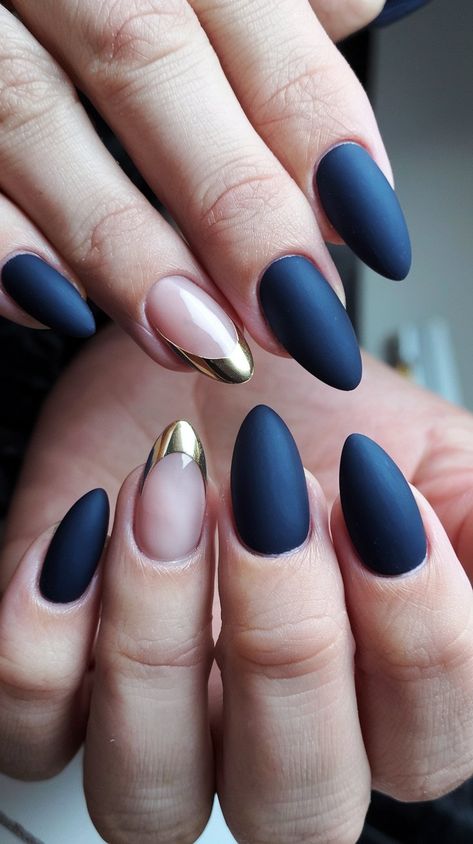 Elevate your nail game with this stunning matte navy and gold accent manicure! Featuring a chic mix of matte nails and a glamorous gold tip, this design is both elegant and modern. The unique nude accent nail adds a trendy twist, making it perfect for any occasion. Get inspired to try this sophisticated look! #NailArt #MatteNails #NailInspiration #septembernails #fallnails Navy Nails Gold Accent, Fall Nails Navy Blue And Gold, Navy And Bronze Nails, Matte Blue And Gold Nails, Elegant Navy Blue Nails, Navy And Copper Nails, Fall Navy Nails, Nails To Go With Navy Dress, Navy Dip Nails