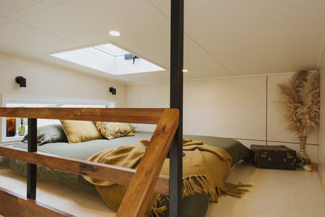 An operable skylight in the loft bedroom ventilates the tiny home and harnesses sunlight for the bedroom as well as the living area below. #dwell #tinyhomes #newzealand Cheap Rustic Decor, Tiny House Bedroom, Plot Of Land, Light Hardwood Floors, New Zealand Houses, Minimalist House, Fireplace Remodel, Bedroom Loft, Updating House