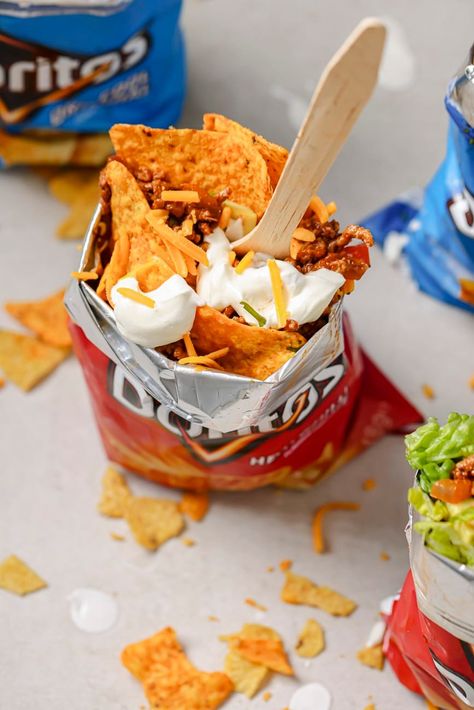 Handheld and tasty, this Doritos Walking Taco recipe is your new favorite portable snack! This is an easy way to turn a bag of chips into a mini taco bowl that you can take on the go. Walking Snacks, Mexican Snack Foods, Walking Tacos Recipe, Doritos Taco, Mini Taco, Walking Taco, Easy Taco Recipes, Taco Bowl, Walking Tacos