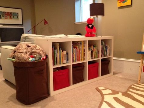 hide kids toys in the living room Rec Room Basement, Diy Hidden Storage Ideas, Creative Toy Storage, Living Room Toy Storage, Family Friendly Living Room, Play Corner, Basement Playroom, Behind Couch, Living Room Corner