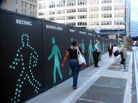 New York construction fence Walking Men (Broken Sidewalk) Site Hoarding, Construction Fence, Hoarding Design, Pedestrian Walk, Face Line Drawing, Clever Advertising, Construction Signs, Interactive Walls, Signage Display