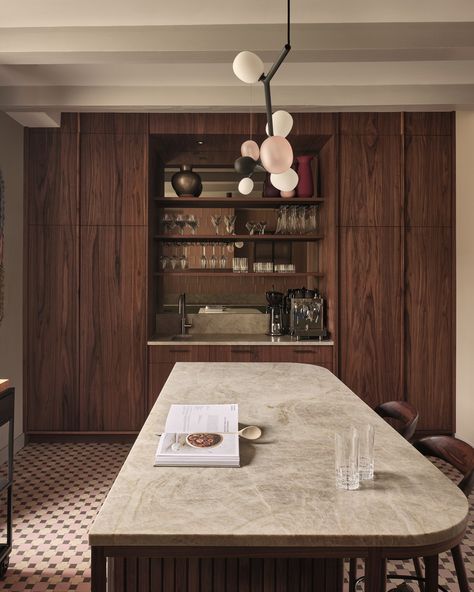 From the walnut wood cabinets to the brass hardware, this kitchen is a work of art. Set in a canal house in Amsterdam, the charming setting with its retro twist, creates a nostalgic feeling. The deep brown hues beautifully complement the Gaggenau 400 series oven which is perfectly fitted between the wood cabinets and brass hardware.​

Kitchen design: Robert Tediek Keukens​
Photogrpahy: Ralph Reniers Rich Wood Kitchen Cabinets, Soho House Kitchen Interior Design, Amsterdam Canal House Interior, Dark Timber Kitchen, Dark Brown Wood Kitchen, Brown Walls Kitchen, Kitchen Ideas Brown Cabinets, Dark Wood Interior Design, Dark Wooden Kitchen