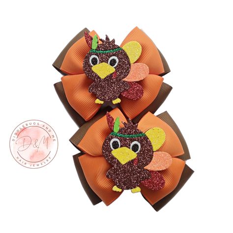 These are the cutest turkey Thanksgiving hair bows.  Bows are double layer and is made with orange and brown grosgrain ribbon. In the center of each bow, you will find an  adorable glitter turkey. They are made with your choice of hair clips and are partially lined with grosgrain ribbon.  All ribbon ends have been heat  sealed to prevent fraying.  Bows measure about 3.50 inches long. Always use supervision while little ones are  wearing hair accessories as they may contain small parts that could Turkey Hair Bow, Turkey Bow, Thanksgiving Hair Bows, Thanksgiving Bow, Fall Hair Bow, Thanksgiving Hair, Pigtail Bows, Ribbon Ends, Girls Holiday