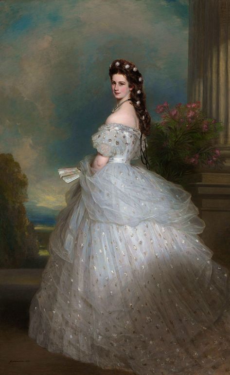 1865 – Sissi wearing an ball gown, believed to be created by Charles Frederick Worth, the most renowned dressmaker of the later half of the 19th century. Embroidered with precious stones and pearls, Sissi’s dress was made of white satin and tulle and is covered with thousands of silver foil stars shimmering throughout her dress. Sissi is crowned with her large braids, creating a natural diadem decorated with diamond edelweiss pins. The edelweiss was the emblematic flower of the Austrian alps. Elisabeth Of Austria, Fashion History Timeline, Franz Xaver Winterhalter, House Of Worth, Victorian Paintings, Princess Aesthetic, Victorian Art, Historical Art, Gala Dresses