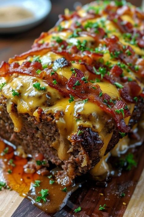 Bacon Cheeseburger Meatloaf is exactly what it sounds like – a savory meatloaf infused with the irresistible flavors of a bacon cheeseburger.

Once you try this Bacon Cheeseburger Meatloaf, you’ll wonder how you ever lived without it! Enjoy Bacon Meatloaf Muffins, Smoked Bacon Cheeseburger Meatloaf, Savory Meatloaf Recipes, Meatloaf With Bacon On Top, Meatloaf On The Grill, Hamburger Meatloaf, Bacon Cheddar Meatloaf, Cheeseburger Meatloaf Recipes, Bacon Cheeseburger Meatloaf