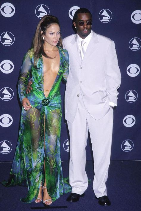 Jennifer Lopez & Sean “Puffy” Combs do it up at the 42nd Annual Grammys. Jlo Diddy, Young Jlo, Jlo 90s, Jlo Hair, Grammy Dresses, Versace Gown, Valentino Gowns, Revealing Outfits, 00s Fashion