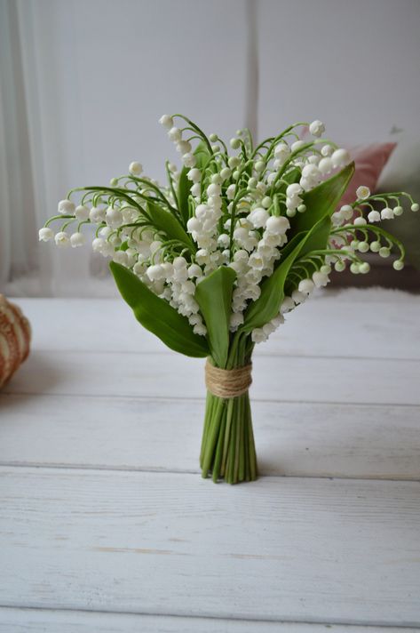 handmade bouquet of lilies of the valley. The flowers are made of floristic polymer clay (cold porcelain). Each flower is sculpted by hand. In the photo of a beech from 40 branches, bouquet diameter 14-15 centimeters. You can choose a bouquet of a smaller size, for this, select the required number of branches with flowers. Fulfillment from 2 weeks the cost of one branch of flowers is $4.5 leaves are included 10 branches with flowers - 7 leaves 15 branches - 9 leaves 20 branches - 10 leaves 25 br Myrtle Bouquet Wedding, Bridal Bouquet And Boutonniere, Wedding Bouquet Lily Of The Valley, Lily Of The Valley Decor, Simple Elegant Wedding Bouquet, Small Peony Bouquet, Simple Bride Bouquet, Water Lily Bouquet, Crocus Bouquet