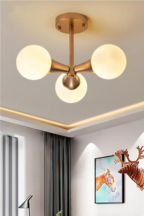 Mid Century Metal Multi Heads Globe Ceiling Lamp is a beacon of timeless elegance to illuminate your interior space. Crafted from durable metal, glass globe ceiling lamp lustrous golden hue exudes opulence and charm, elevating any space it graces. multi heads glass ball ceiling lamp have two options of three or four light heads, offers versatile lighting solutions tailored to your needs. Hall Lights, Village Cottage, Mid Century Dining Room, Modern Ceiling Lamp, Globe Ceiling Light, Round Ceiling Light, Industrial Wall Lamp, Hall Lighting, Modern Ceiling Lamps