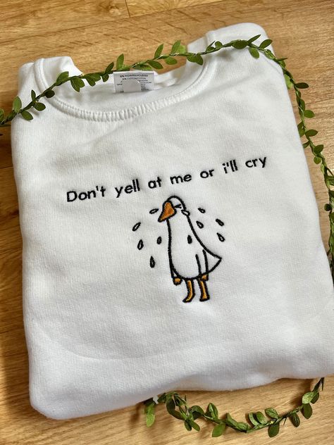 Don't yell at me or I'll cry embroidered duck sweatshirt! All sweatshirts are made within 1-3 weeks. How to order: 1. Select your size 2. Select the colour you would like for your sweatshirt 3. Add to basket and place order Sweatshirt: 50% cotton/50% polyester Unisex design, great for everyone! Colour - Optional (if a colour is out of stock I will message you to notify you) Fit - True to size (if you would like to order a different size that is not listed please message me) Funny Embroidered Sweatshirt, Duck Sweatshirt, Embroidered Duck, Crewneck Embroidery, Embroidery Shirt, Embroidery Tshirt, Embroidered Tote Bag, Cute Shirt Designs, Embroidered Tote