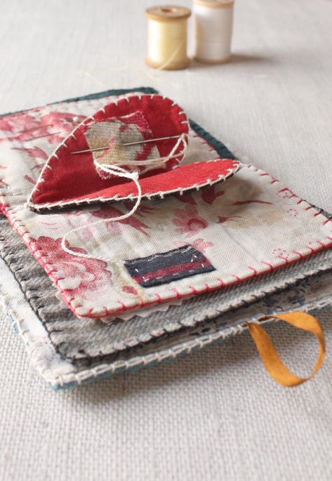 &quot;Stitch a sweet needle book from the scraps you can&#39;t part with. The pattern includes templates and full instruction for a palm size needle book with 4 pages including the cover and heart at the center. The little book will certainly hold your pins and needles and tools or it could tell a story, mark an occasion, like a birth or anniversary, or be a sort of travel journal, the pages filled with little things found along the way and saved.&quot; Ann Wood, Needle Cases, Beginner Sewing Projects Easy, Sewing Needles, Needle Book, Leftover Fabric, Sewing Kit, Sewing Projects For Beginners, Love Sewing