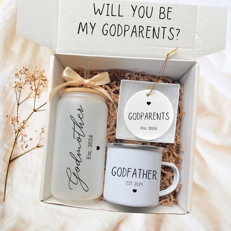 Are you looking for a unique and thoughtful way to ask " Will you be my Godparents? Imagine the joy of discovering not just a gift, but an invitation to be part of your child's life journey. Unboxing this Godparent Proposal box isn't just about the treasures inside; it's about unlocking a special bond that lasts a lifetime.   Honor your godparents with this heartfelt gift set with a personalized Godmother tumbler, mug, and ceramic ornament beautifully packaged with care and love. GODPARENT PROPO Ideas On How To Ask Godparents, Ask Godparents Ideas, Will You Be My Godparents, Godparents Proposal Ideas In Spanish, Will You Be My Godparents Proposal, Godparents Proposal Ideas, Asking Godparents, Godmother Tumbler, Godparent Proposal