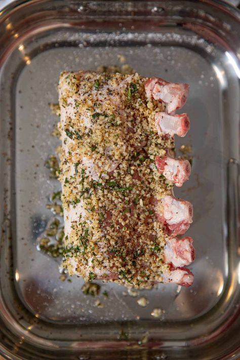 Roasted Rack of Pork is a show-stopping, holiday main dish crusted with garlic, fresh thyme and rosemary or use boneless pork loin for easy weeknight meals. #dinner #pork #porkribs #roastedgarlic #garlic #dinnerthendessert Pork Loin Ribeye Roast Recipe, Rack Of Pork Recipes, Pork Rib Roast, Brown Sugar Pork Chops, Rack Of Pork, Herb Rack, Pork Loin Roast Recipes, Rib Roast Recipe, Pork Chop Recipes Baked