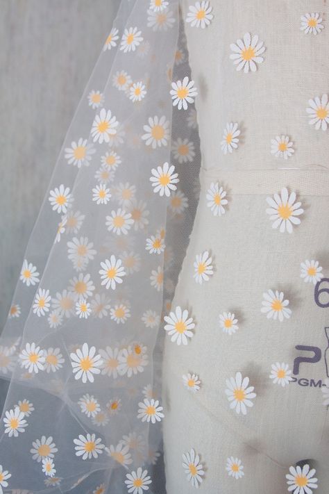 "Arriving next week. Back in stock by demand. Orders yours before it's gone. Need a cute, lightweight & sheer fabric for your special occasion? This printed daisies on off white tulle is perfect for the bride to be, flower girl or even just as window shades! Make hair ties and head bands with this daisy flower tulle. It is 63\" wide so 1 yard would be plenty for hair accessories. How about some pretty socks to go with your wedding guest attire? Use your creativity and I'm sure you'll find a spec Chiffon Printed Fabric, Tela, Couture, Printed Sheer Fabric, Daisy Flower Painting On Fabric, Fabric Painting Ideas, Floral Fabric Prints, Flower Tulle, Pretty Socks